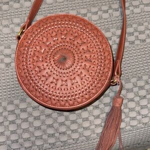 Brown woven round tassel shoulder bag adjustable strap worn once